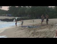 Guy Poses Picture Of White Surfboard on Beach
