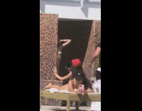 Green bikini girl dances brown public shower 