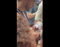 Guy glues sole of sneaker 