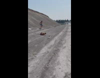 Shirtless guy running down hill falls fail 