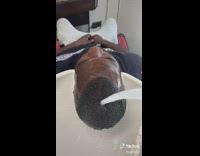 Barber sprays water on clients face prank 