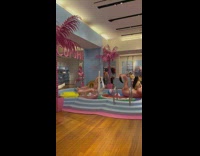 Woman in bikini poses inside the lingerie store