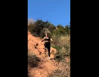 Girl falls while walking down trail