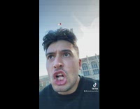 Group of people in parking running towards guy 