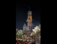 Huge white spider hanging on Jefferson library tower 