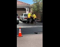 Three men wipes busted sealant on car