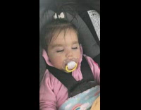 Baby girl sleep suck pacifier car seat