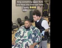 Barber sings blows into ear prank guy 