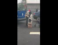 Guy sits walker blocks blue bus street