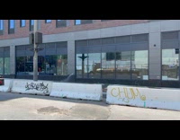 Water shooting out from hole on building