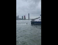 Blue boat fishes rescues guy in river 