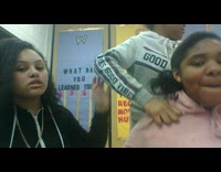 Group of girls dance to Baby Shark song in classroom