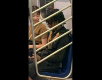 Man with lizards on him inside train