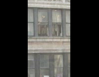 Group of people dance dressed as ghosts