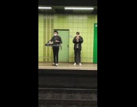 Guy with DJ turntable hanging around neck 