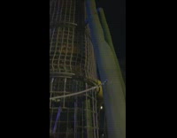 Woman climbs and slides on the dangerous slide at the park