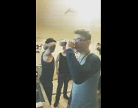 Guy takes swig of alcohol from bottle