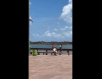 Man sparkly cape dances for park video