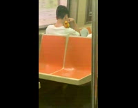 Man on train with yellow orange bird