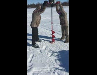 Collab BitchIG2 - Two people drill hole in ice fishing