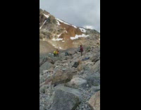 Snow mountains two people jump photo