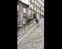 Lean to side pose on colorful stairs 