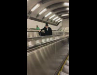 Man wear halloween costume at escalator in subway 