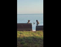 Guy beard selfie with friend pool umbrella