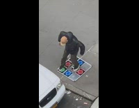 man dancing on arcade game street