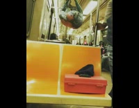 Green Shirtless Guy Glasses Hangs From Subway Railing