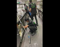 Guy squats sneaks eats food work kitchen 