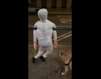 Collab WINY - Dummy hangs on scaffolding railing at sidewalk