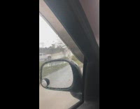 Rain spins on the car window by the wind