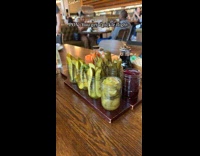 Friends have a pickle fight on restaurant
