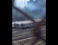 Submitter films bush fire behind train station
