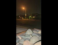 Guys shoot fireworks at each other street 