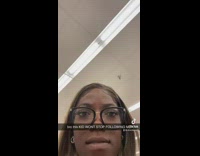 Little girl staring at woman from around corner 