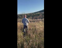 Man help deer foot caught in fence