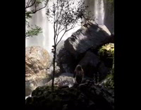 Girl poses in front of waterfall 