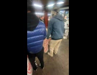 Guys brings food table in the subway