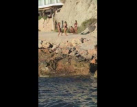 Four women bikini tiktok dance beach rocks