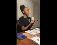 Family playing charades card game 