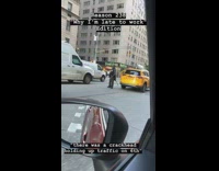 Homeless man stands in the middle of traffic on busy New York street