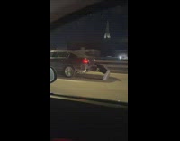Rear end bumper hanging off car while driving