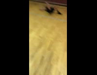 Guy goes for rebound but slips on ground and lands on back