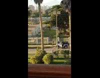 Collab IITW - Woman long boots dances on the sidewalk