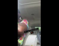 Woman hits husband with purse backseat