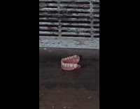 Leftover dentures under a subway seat