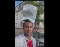 Man balance block of ice on head