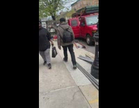 Guy plays EDM from backpack